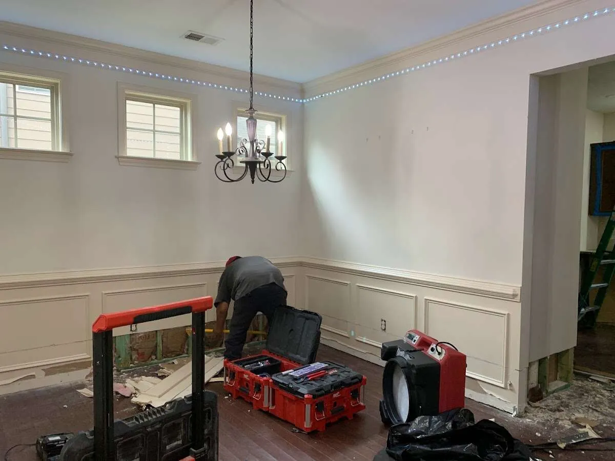 Restoration technician with professional equipment in West Athens
